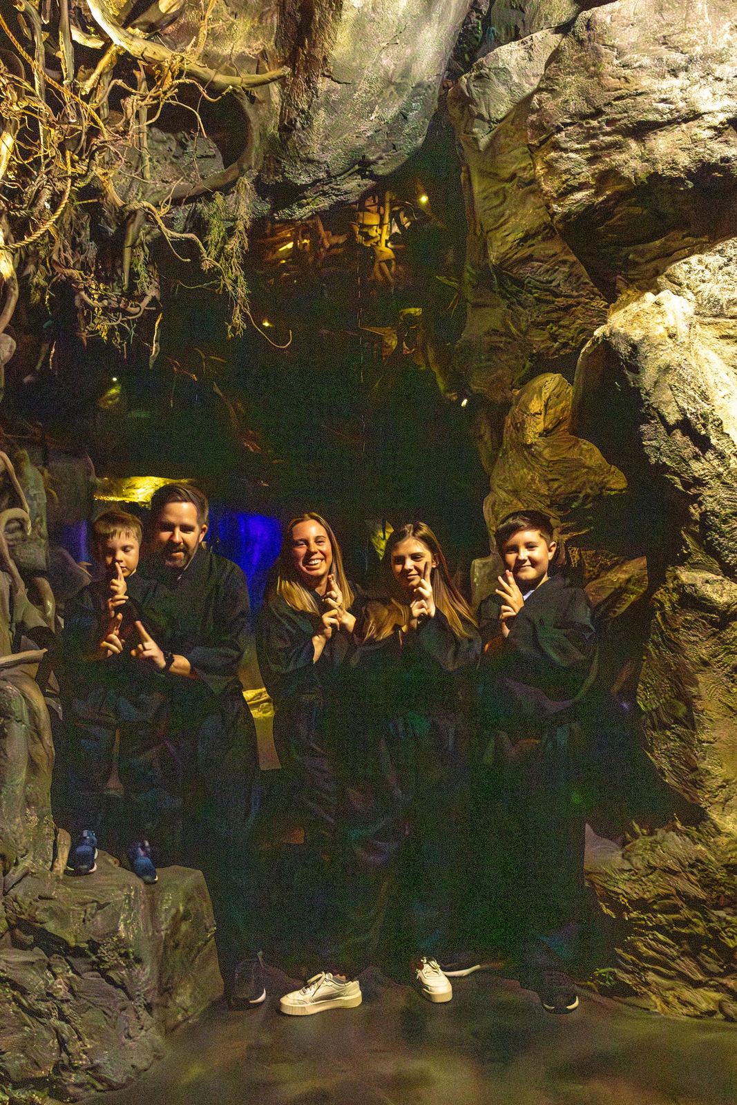 Family in ninja costumes inside the cave experience