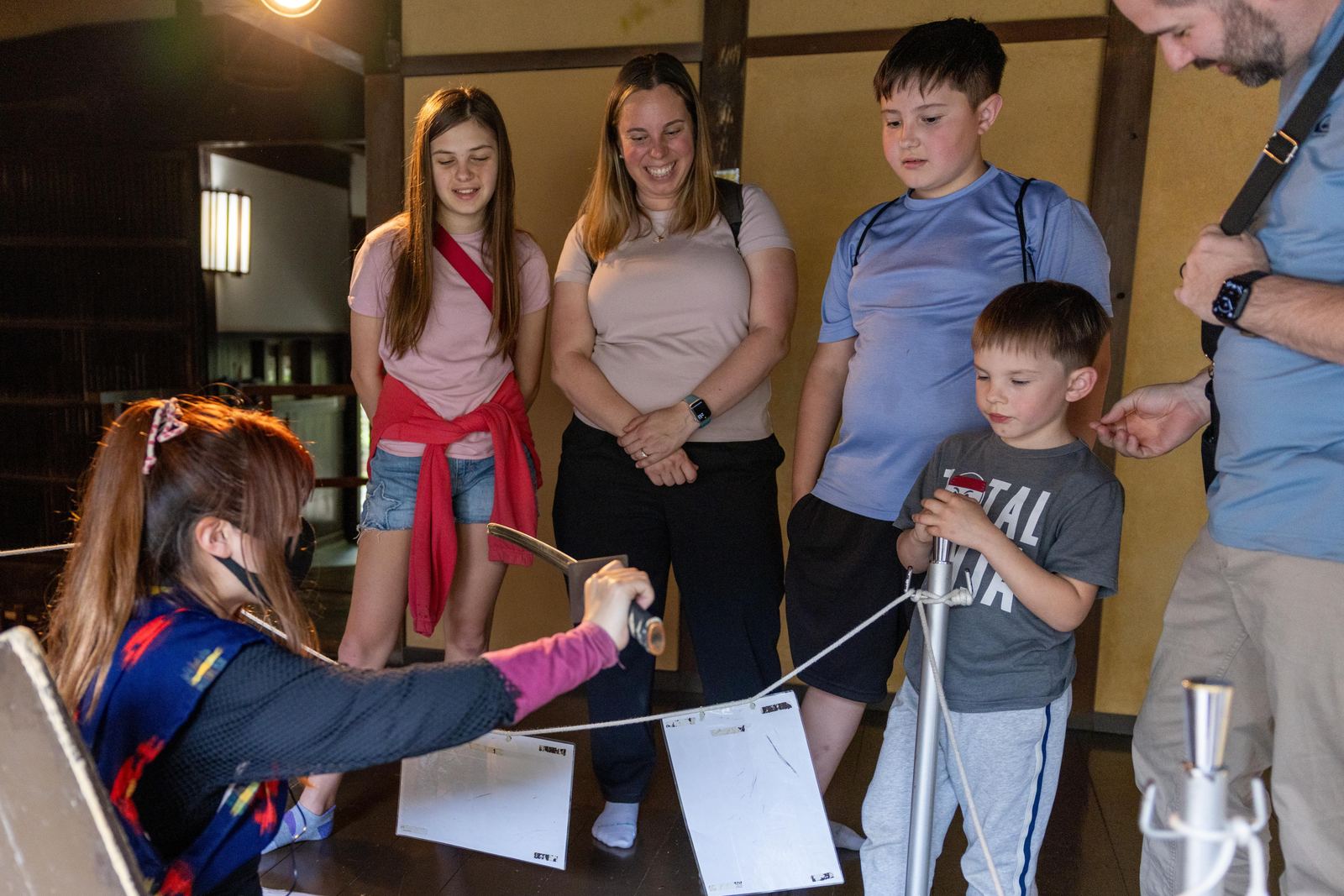 Child holding a colourful origami shuriken outside