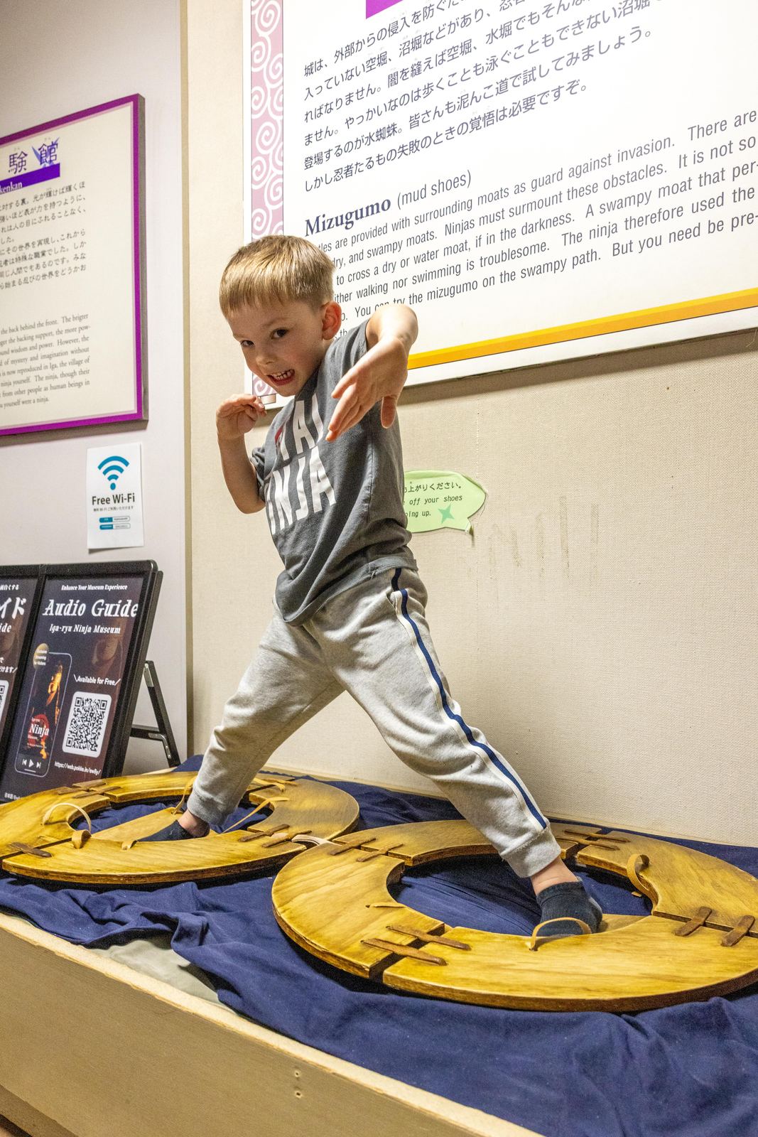 Young child striking a ninja pose on the Mizugumo