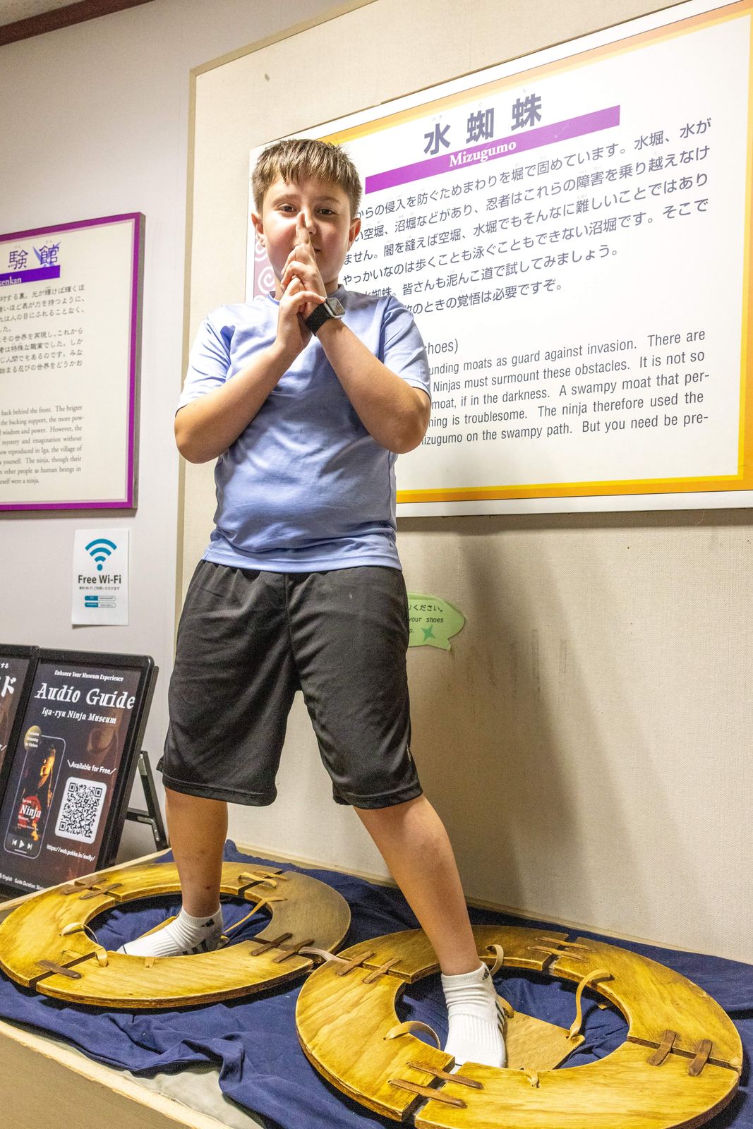Boy standing on Mizugumo water-walking shoes