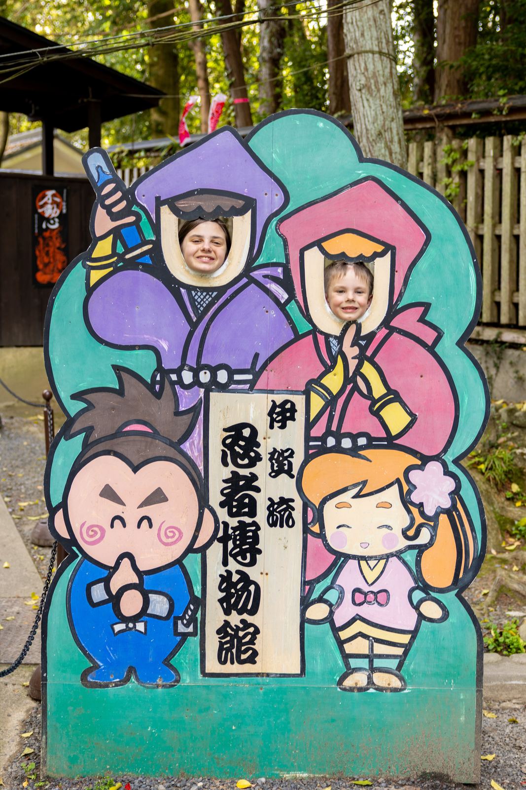 Kids posing at the Iga Ninja Museum face-out board