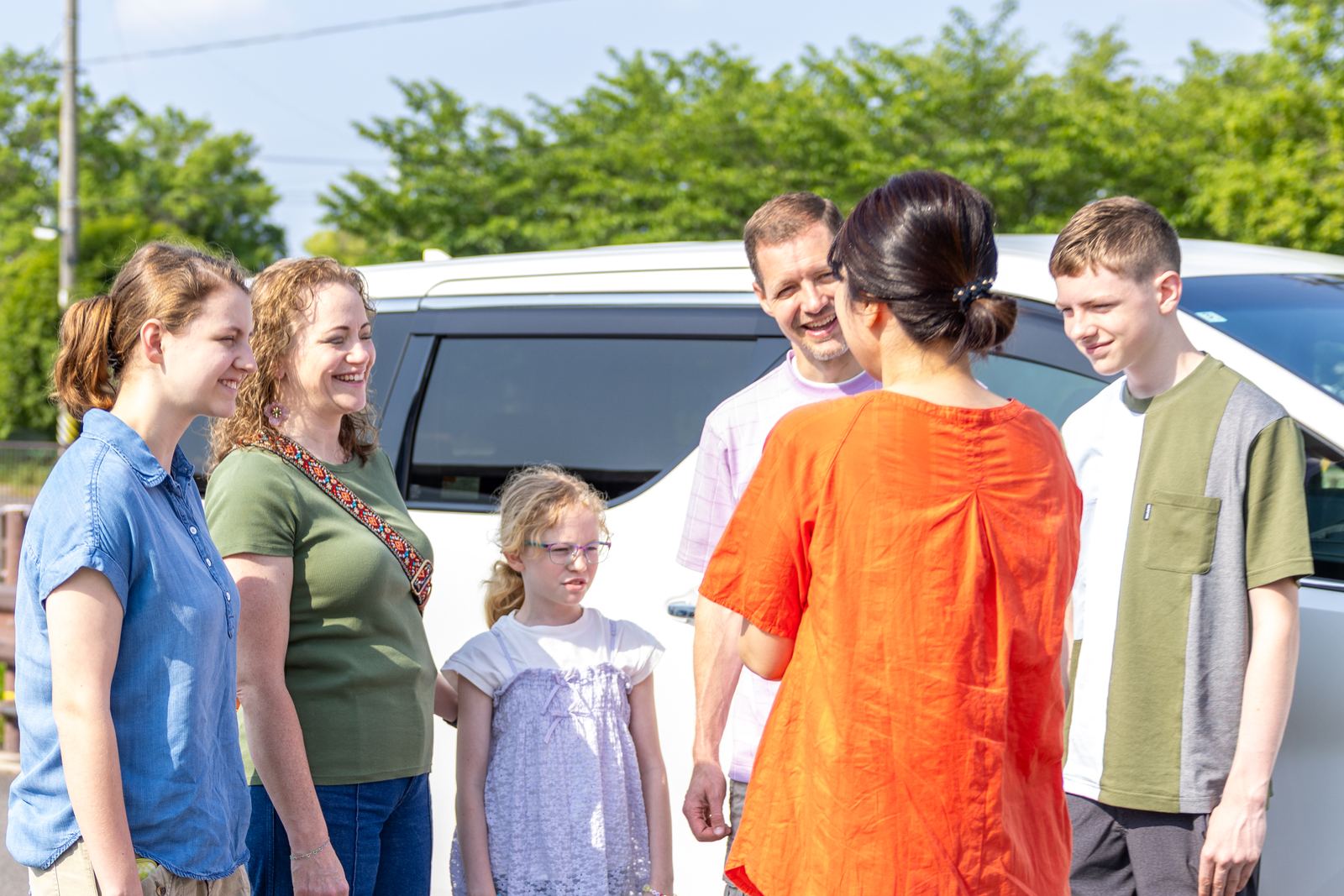 Guests meeting their guide beside the private vehicle