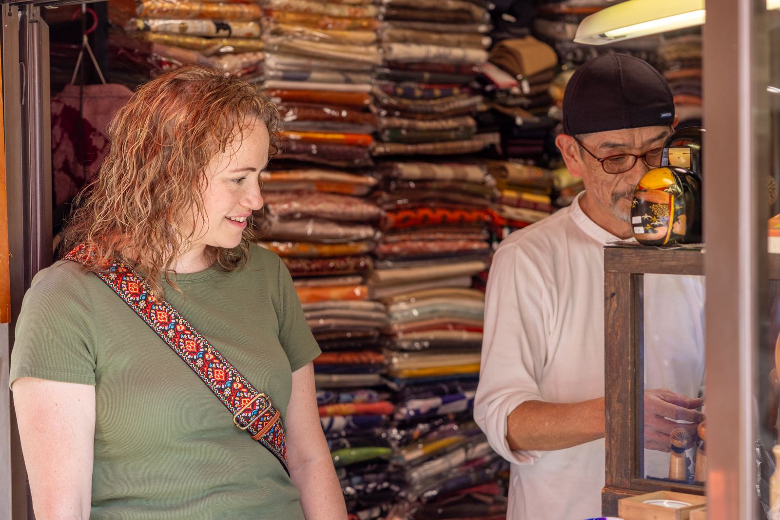 Guest chatting with a Takayama fabric shop owner